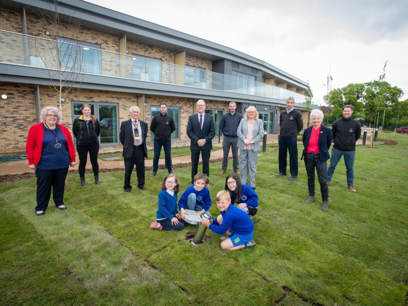 Schoolchildren bury time capsule to celebrate completion of Marleyfield House care home expansion